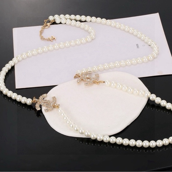 Chanel Gold Scratchy CC Irregular Pearl 2 Strand Necklace  CHANEL White Pearl Double-Strand Necklace with Gold CC Crystal Pendants